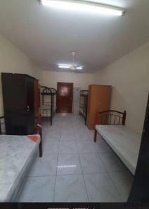 Sharing Room /BED SPACE for Bachelor in Karama ,Near ADCB